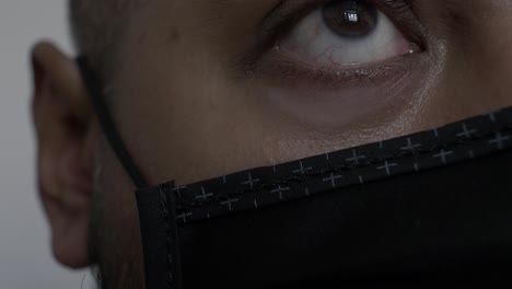 Close-Up-View-Of-Adult-UK-Asian-Male's-Left-Eye-Wearing-Cotton-Face-Mask