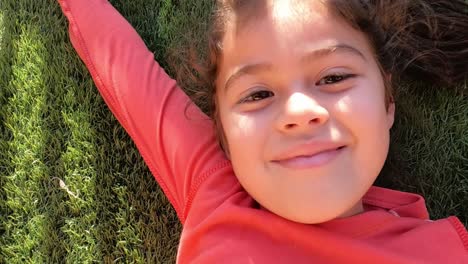 Children's-Day,-girl-rests-on-the-grass