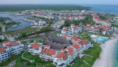 Orbit-Circle-Around-Empty-Luxurious-High-End-Hotels-and-Residences-at-Cap-Cana-Marina,-in-Dominican-Republic-during-a-Clear-Evening-during-Coronavirus--COVID-19-Quarantine