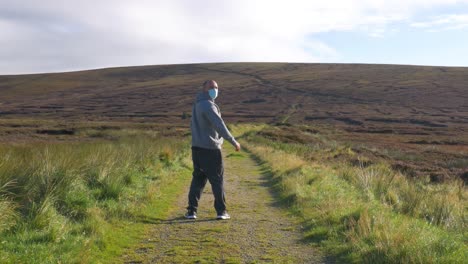Wanderer-irish-man-isolating-with-mask-at-Wicklow-mountains