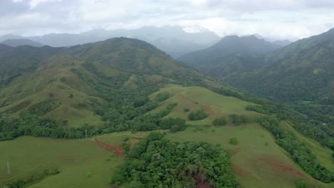 Scenic-flight-lateral-displacement-overlooking-the-green-fields-of-bonao,-dominican-republic