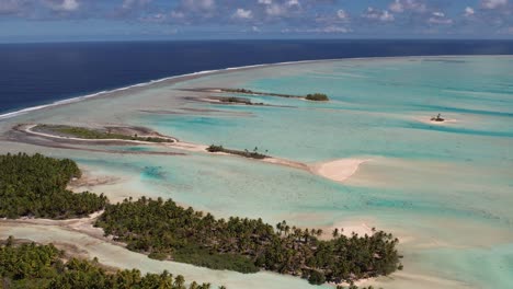 Beautiful-Aerial-drone-shot-of-the-lagoon,-reef-and-ocean-of-the-atoll-of-Fakarava,-French-Polynesia,-south-pacific