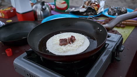 Smooth-Handheld-Real-Time,-Cooking-a-Steak-and-Veggie-Quesadilla-on-Outdoor-Stovetop-Grill-and-Skillet-at-Campsite
