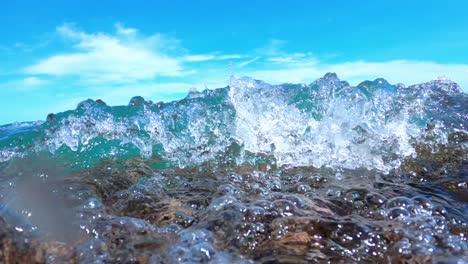 Crystal-clear-sea-water-in-slow-motion-motion,-highlighting-the-beauty-of-the-caribbean-sea-on-clear-day