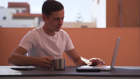 Closeup-footage-of-a-male-typing-on-the-laptop-at-the-table