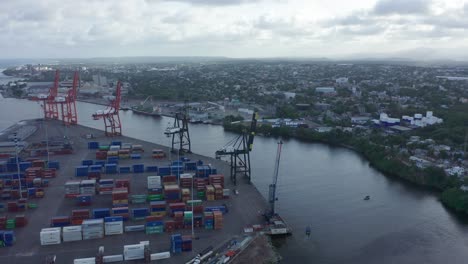 Haina-Port-Is-stacked-up-with-shipping-containers-during-the-morning-before-opening-hours-Drone-aerial-overcast-day
