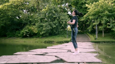 Asian-woman-exercise-in-park-outdoor-with-new-normal-in-COVID-19-situation