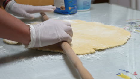 Woman-prepares-homemade-cheese-pie,-focusing-on-hands-120fps