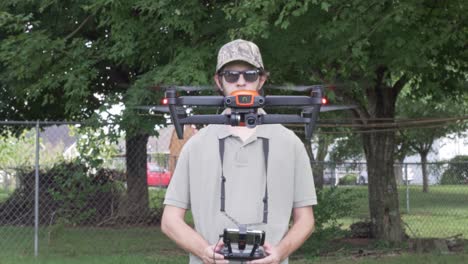Professional-Drone-Pilot-Flies-drone-UAS-up-and-towards-camera