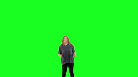 A-mature-woman-bounces-on-a-trampoline-in-front-of-a-green-screen