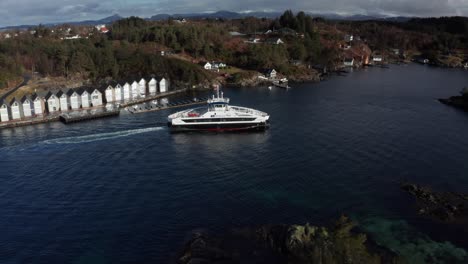 Aerial-shot-over-Electric-passenger-ferry-sailing-through-narrow-waters---Norway