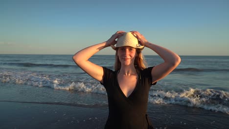 Pretty-Caucasian-Girl-In-A-Dress-And-Hat-Enjoying-Summer-Beach-At-Monte-Hermoso,-Buenos-Aires,-Argentina