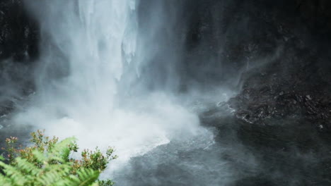 Super-slow-motion-shot-of-splashing-and-spraying-Akaka-waterfall-in-Hawaii-during-sunny-day