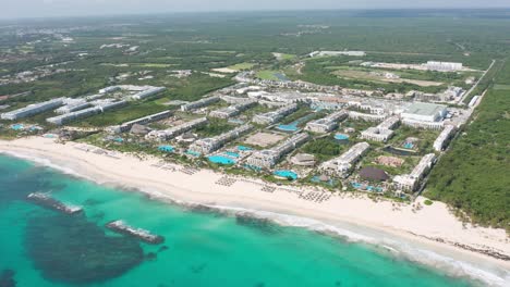 Luxury-Beachfront-Hotels-By-The-White-Sand-Beach-With-Turquoise-Blue-Sea-In-Punta-Cana,-Dominican-Republic