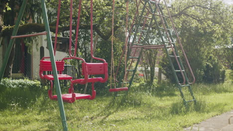 Wide-shot-of-a-typical-German-swing-set-in-the-garden-on-a-sunny-spring-day