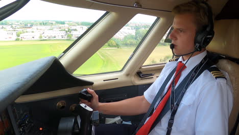 Young-Caucasian-Pilot-in-Cockpit-Flying,-Landing-a-Private-Jet-STATIC
