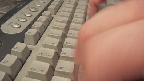 Person-typing-on-computer-keyboard