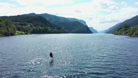Incredible-experience-riding-swing-above-sea-surface-with-panoramic-view-of-Veafjorden-in-Norway
