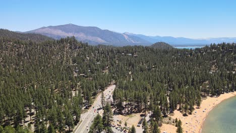 Drone-flying-over-Zephyr-Cove-and-Highway-50-towards-Heavenly-ski-resort-and-South-lake-Tahoe