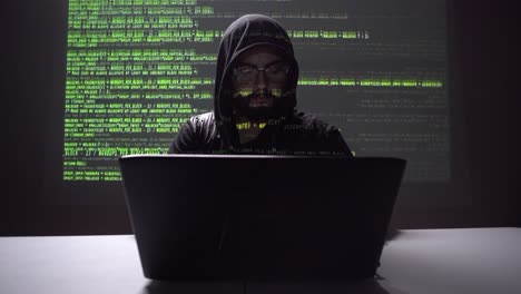 cybersecurity-concept.-hacker-stealing-information-from-his-laptop