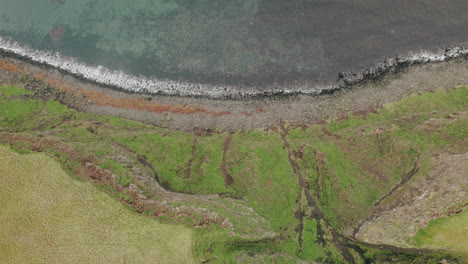 Aerial-bird's-eye-rise-over-shoreline,-topography,-Grimesy-Island,-Arctic-Circle