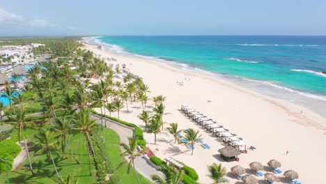 Aerial-View-Of-White-Sand-Beach-With-Palm-Trees-And-Seascape-In-Summer-Near-Hard-Rock-Hotel-And-Casino-Punta-Cana-In-Dominican-Republic