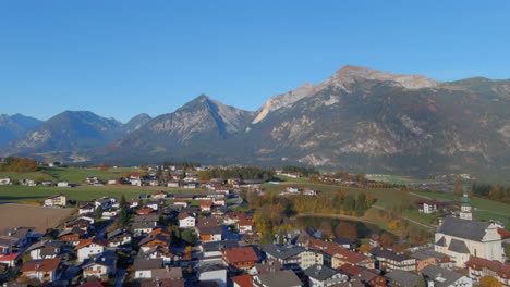 Soothing-morning-flyover-of-village-in-Tirol,-Austria,-drone-push-forward-shot