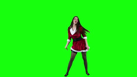 Attractive-and-energetic-female-dancer-dancing-in-front-of-the-green-screen-in-Christmas-costume
