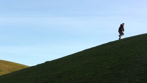 Wide-Iconic-Shot-of-Boxer-Running-up-a-Steep-Grass-Hill-Training