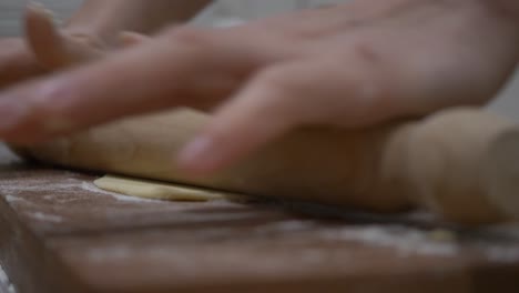 Rolling-all-purpose-flour-dough-to-make-Faworki-polish-dish