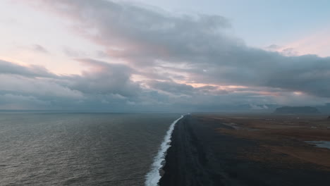 Static-aerial-slow-motion-clip-of-black-sand-shoreline-in-Iceland