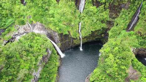 Drone-rises-high-over-the-Takamaka-waterfalls-on-the-Marsouins-River,-Reunion-Island