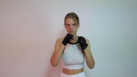Young-female-boxer-practicing-shadowboxing