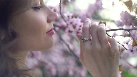 Girl-romantically-sniffing-spring-flowers