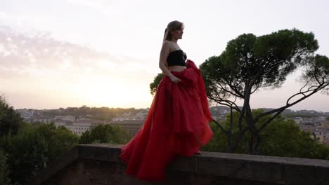 Woman-dancing-on-a-balcony-in-Italy---beautiful-sunset-shot