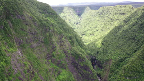 Aerial-view-over-mountains-on-Reunion-Island-with-the-Takamaka-waterfalls-and-Marsouins-River-below