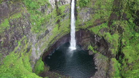 Aerial-zoom-out-from-one-of-the-Takamaka-waterfalls-on-the-Marsouins-River,-Reunion-Island