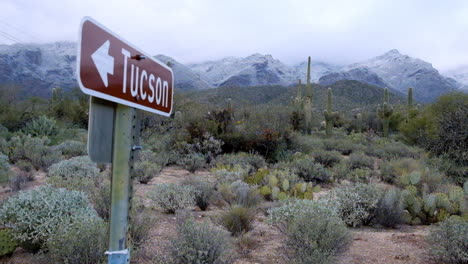 Welcoming-Tucson-city-board-in-the-countyside-dry-landscape-bushes,-at-winter-season
