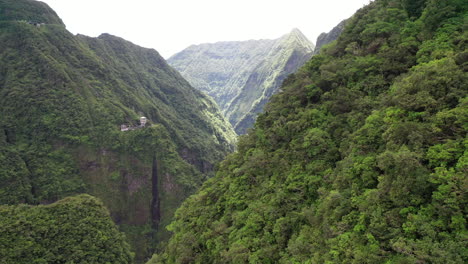 Aerial-flight-over-the-dramatic-rugged-mountains-on-Reunion-Island-with-the-Takamaka-waterfalls-and-Marsouins-River-below