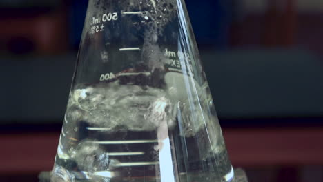 Surface-of-rapidly-boiling-water-in-an-erlenmeyer-flask