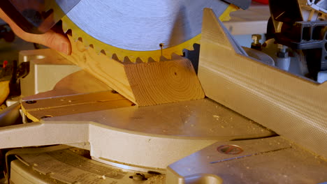Using-a-miter-saw-to-cut-a-wood-plank-2X4---close-up