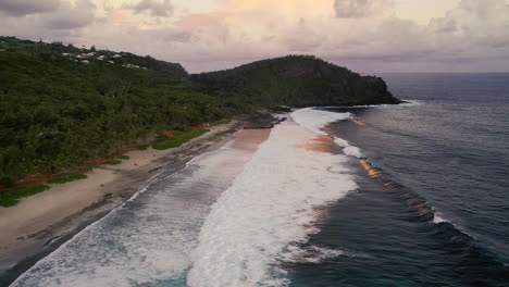 Drone-flight-over-the-Grand-Anse-beach-and-breaking-ocean-waves-on-Reunion-Island