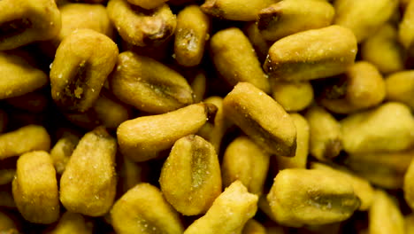 Close-up-rotation-of-toasted-corn-kernels-spinning-in-circular-rotation
