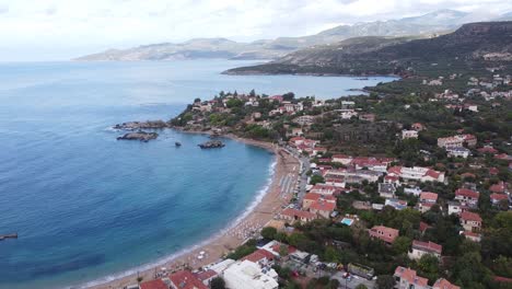 Stoupa-Beach-Town-during-Late-Summer-at-Peloponnese,-Greece---Aerial