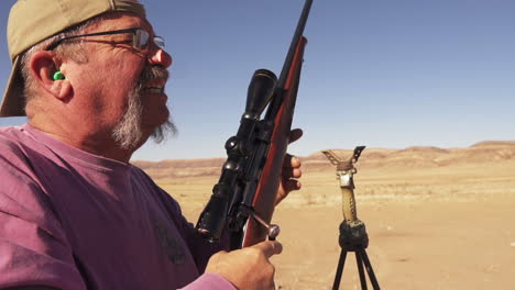 Senior-Man-Practicing-Shooting-With-A-Rifle-Using-Scope-And-Reloading-Gun