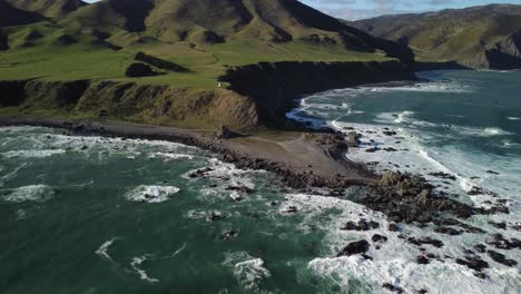 Flying-towards-tongue-point,-Wellington-south-coast,-New-Zealand
