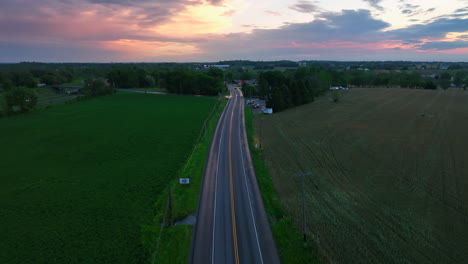 Aerial-reverse-pull-back-of-rural-country-road-in-America