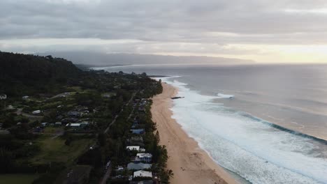 4K-cinematic-counterclockwise-drone-shot-of-waves-crashing-on-Banzai-Beach-on-Oahu's-North-Shore-during-sunset