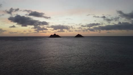 4K-cinematic-crane-drone-shot-of-two-islands-and-the-ocean-from-Lanikai-Beach-in-Oahu-during-dawn