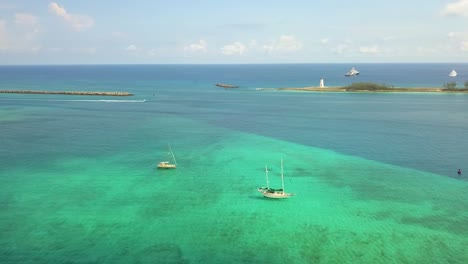 Aerial-view-overlooking-sailing-boats-on-the-coast-of-Nassau,-Bahamas---panoramic,-drone-shot